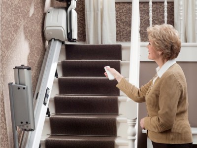 homeglide straight stairlift wwoman using remote control